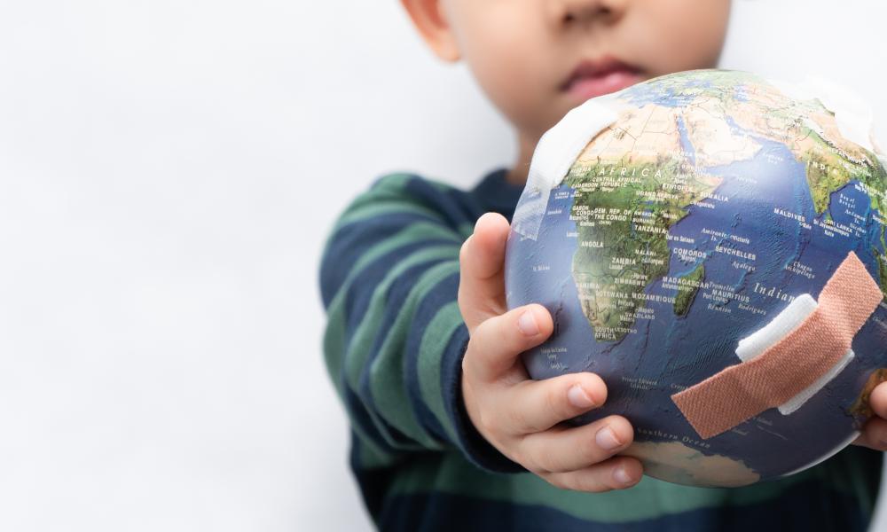 Boy holding globe